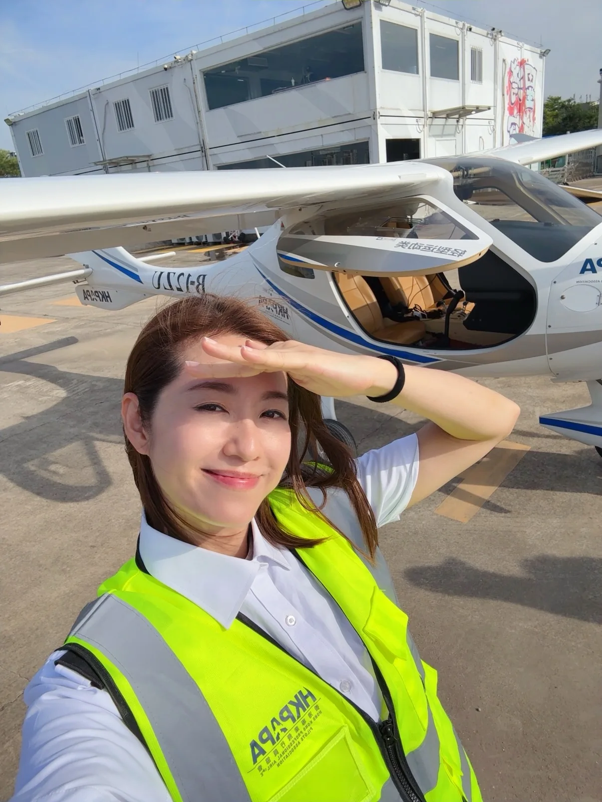 On the apron beside the aircraft