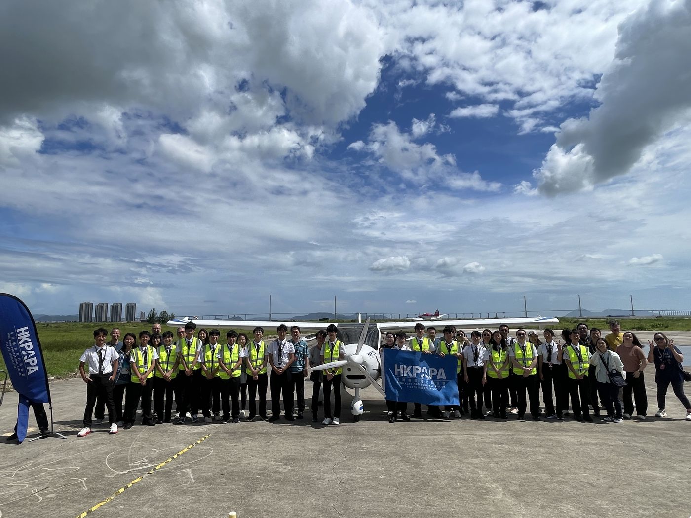 HKPAPA cadets beside a light training aircraft