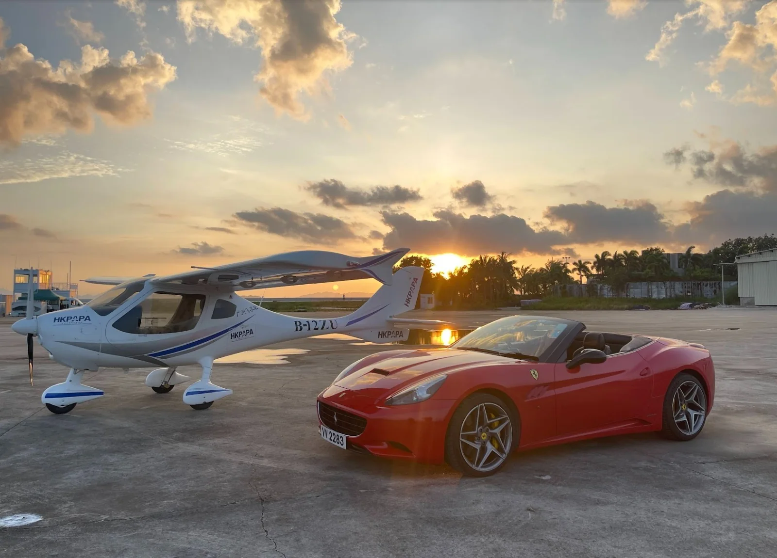 Training aircraft photographed at sunset